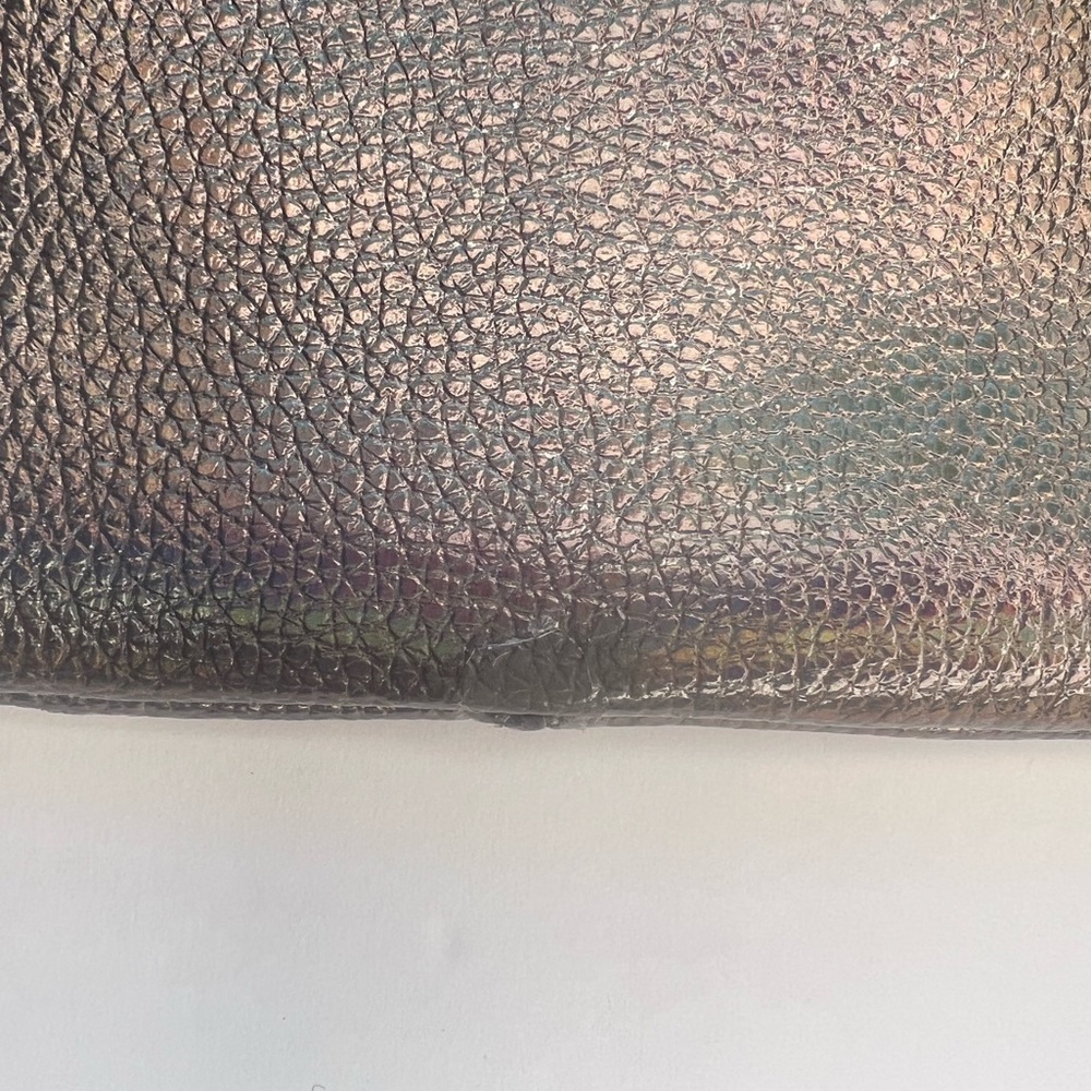 Juicy Couture Bronze iridescent Wristlet Clutch
Some wear - look closely - Picture 2 of 7